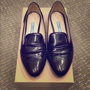 Beautiful class Prada loafers.